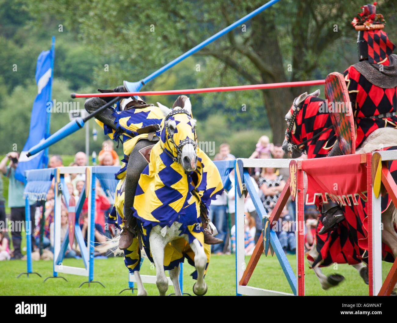 Medieval knight knocked off horse during jousting tournament Stock Photo