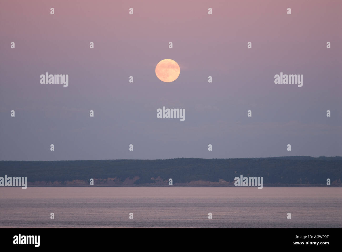 Full Moon over the Bay of Fundy from Cape Enrage New Brunswick Canada Stock Photo