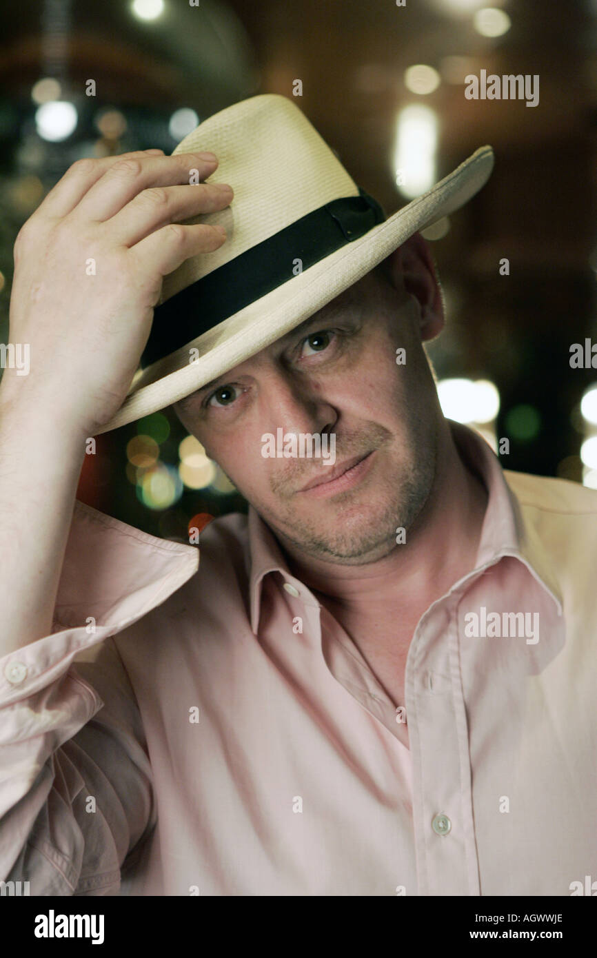 Marco Pierre White close up of celebrity chef at Frankies London restaurant wearing a panama hat tipping hat Stock Photo