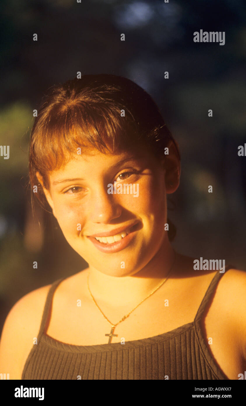 Cross necklace teenage girl hi-res stock photography and images - Alamy