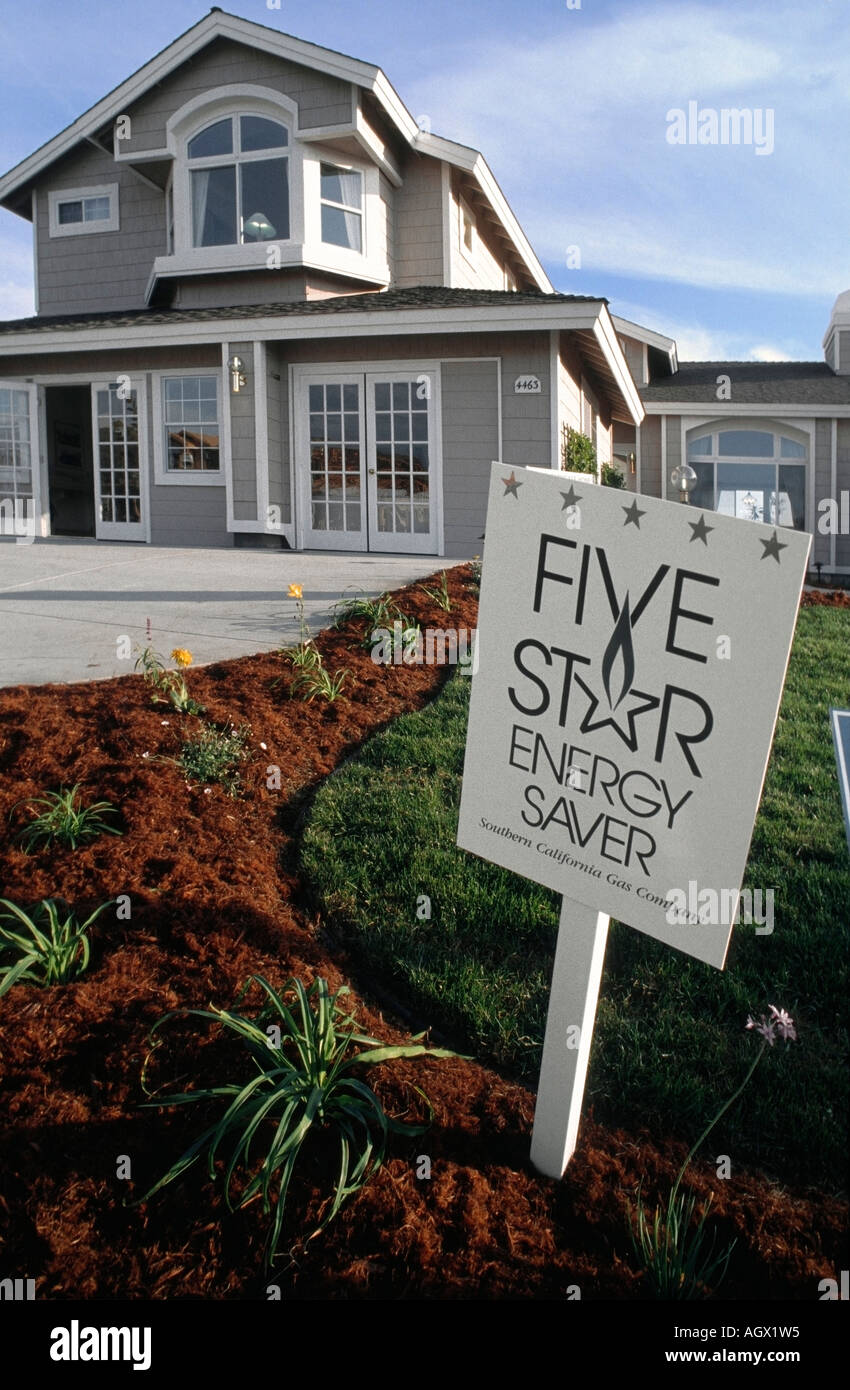 a sign in front of a model home for energy saving stock photo
