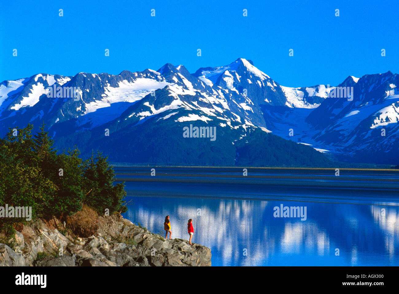 USA Alaska Kenai Mountains and the Turnagain Arm near Girdwood and Alyeska Resort Two women enjoy the view Stock Photo