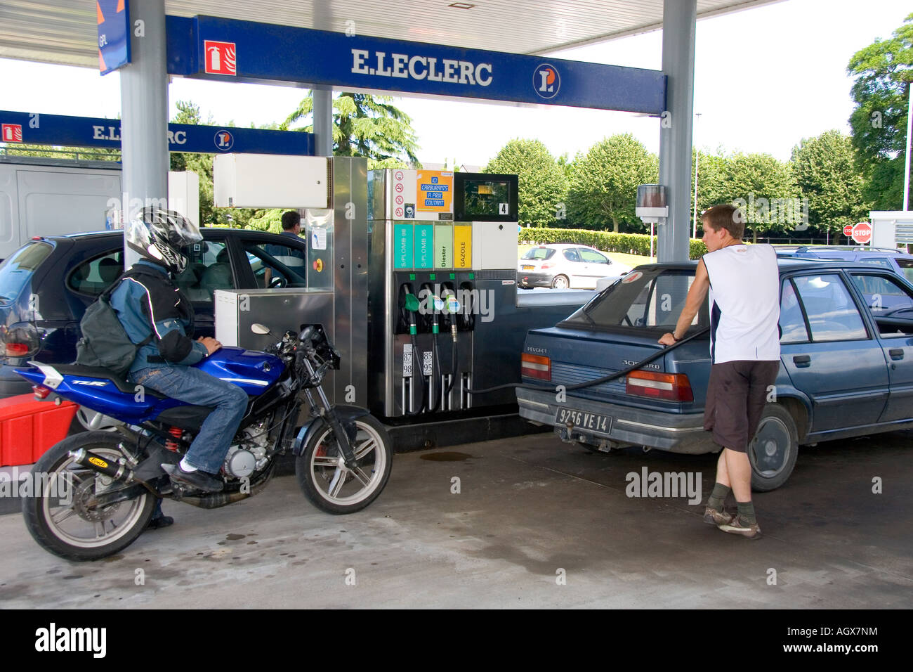 Automobiles fueling up at a gas station in Bayeux in the region of Basse Normandie Normandy France Stock Photo