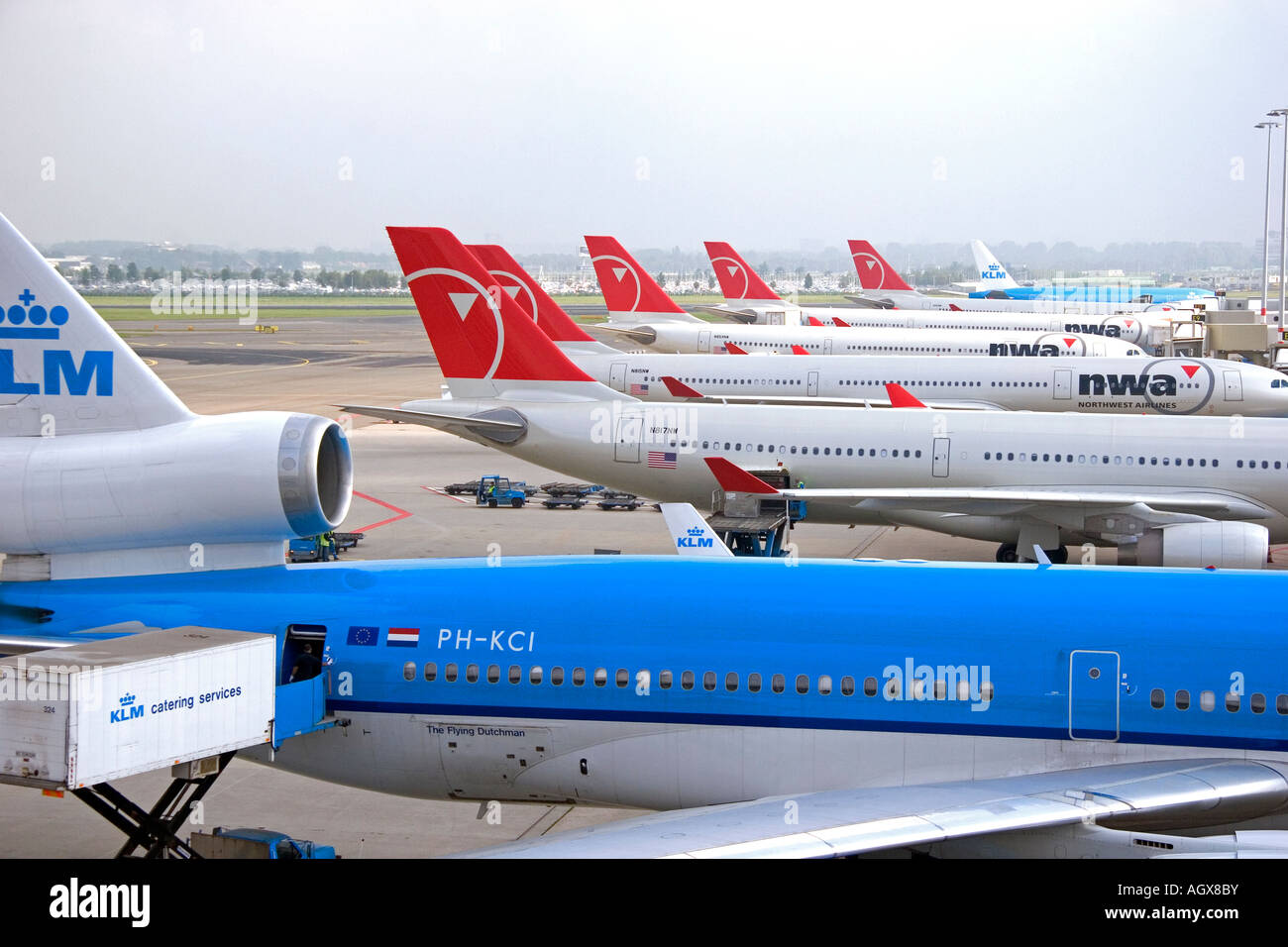 Airplanes parked at Schiphol Airport in Amsterdam Netherlands Stock Photo