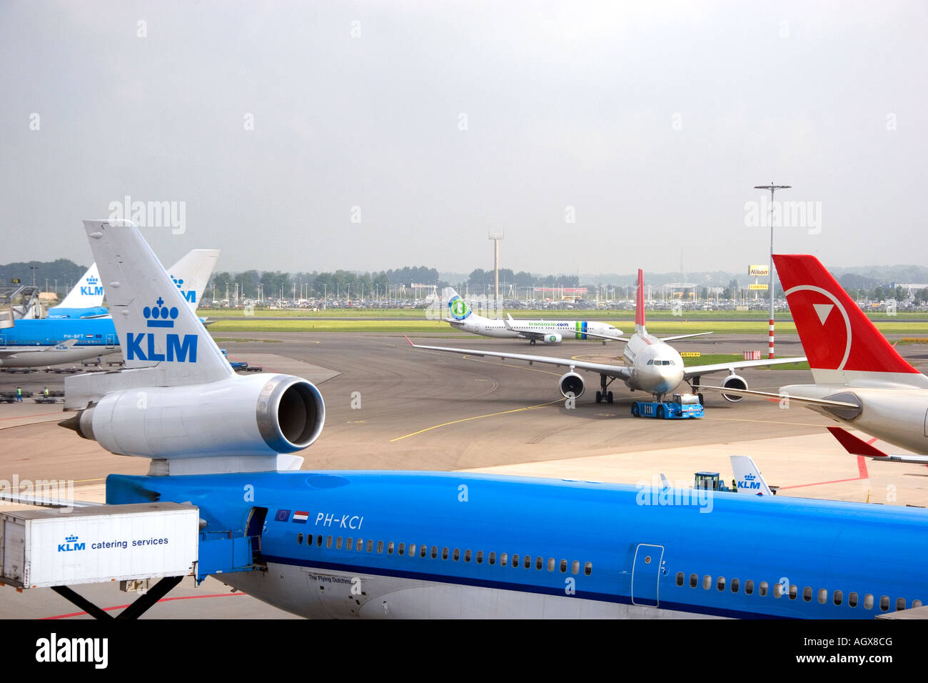 Airplanes at the Schiphol Airport in Amsterdam Netherlands Stock Photo