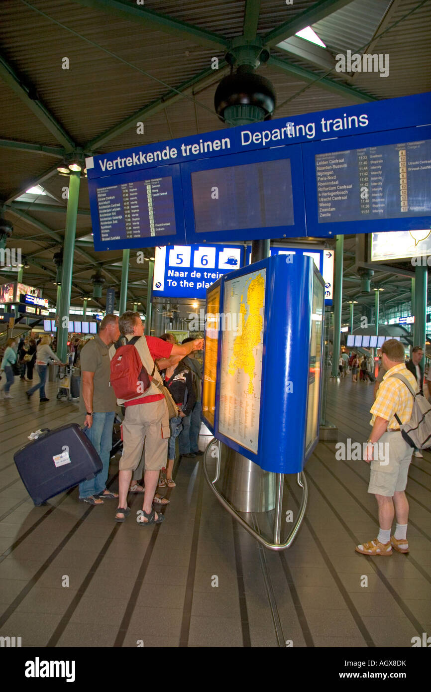 People buy tickets for the train in the terminal at Schiphol Airport in Amsterdam Netherlands Stock Photo