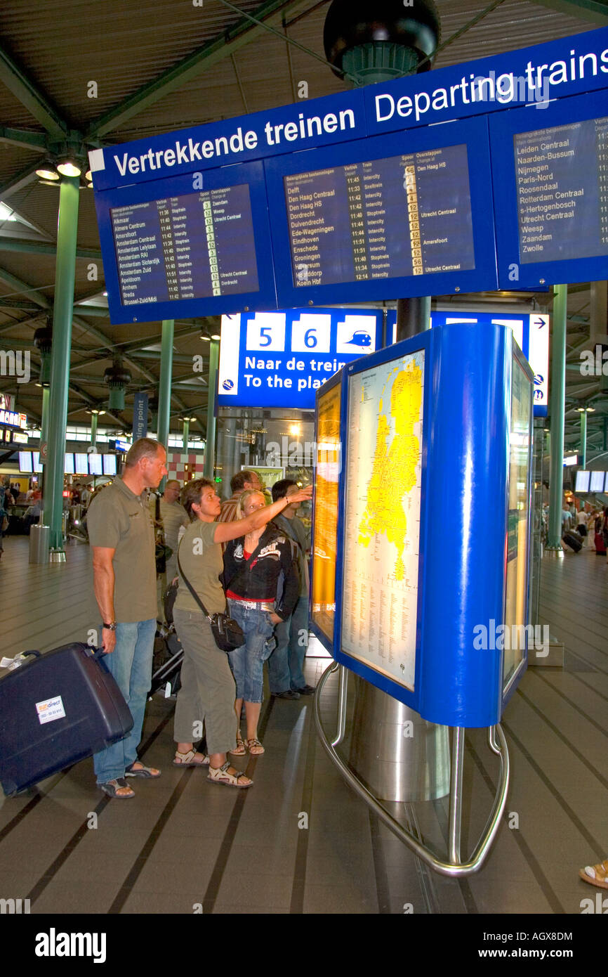 People buy tickets for the train in the terminal at the Schiphol Airport in Amsterdam Netherlands Stock Photo