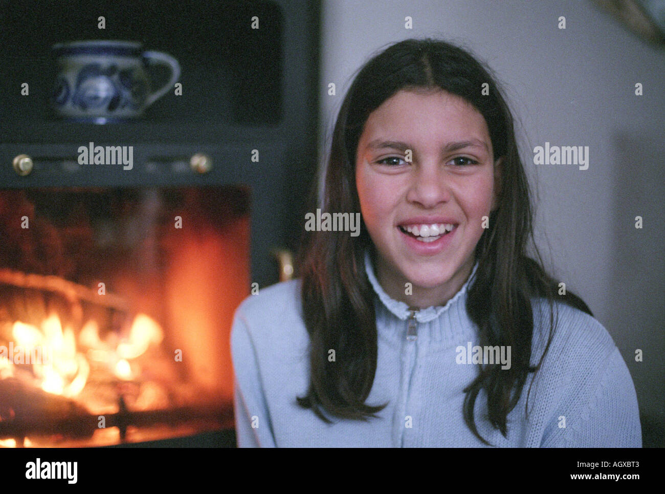 Portrait of teeny girl in front of fire Stock Photo Alamy