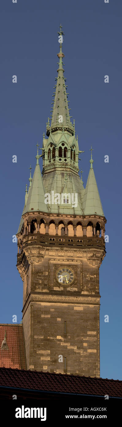 vertical panorama of Braunschweig town hall tower with the rooftop of Burg Dankwarderode visible in the foreground Stock Photo