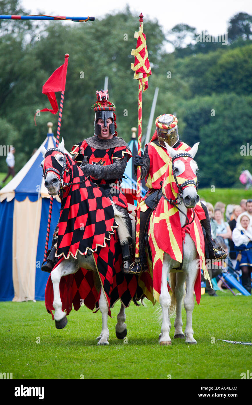 Medieval knights on horseback holding lance during reenactment