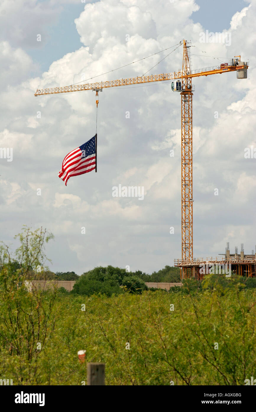 American flag hanging from crane on the Fourth of July San Antonio Texas USA Stock Photo