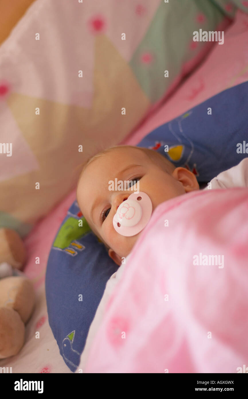 baby lying in bed Stock Photo Alamy
