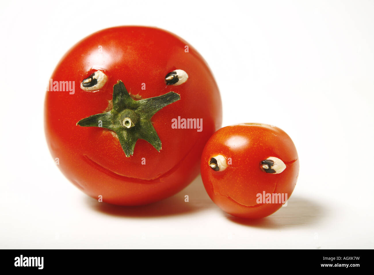 Funny tomatoes on white background Stock Photo - Alamy