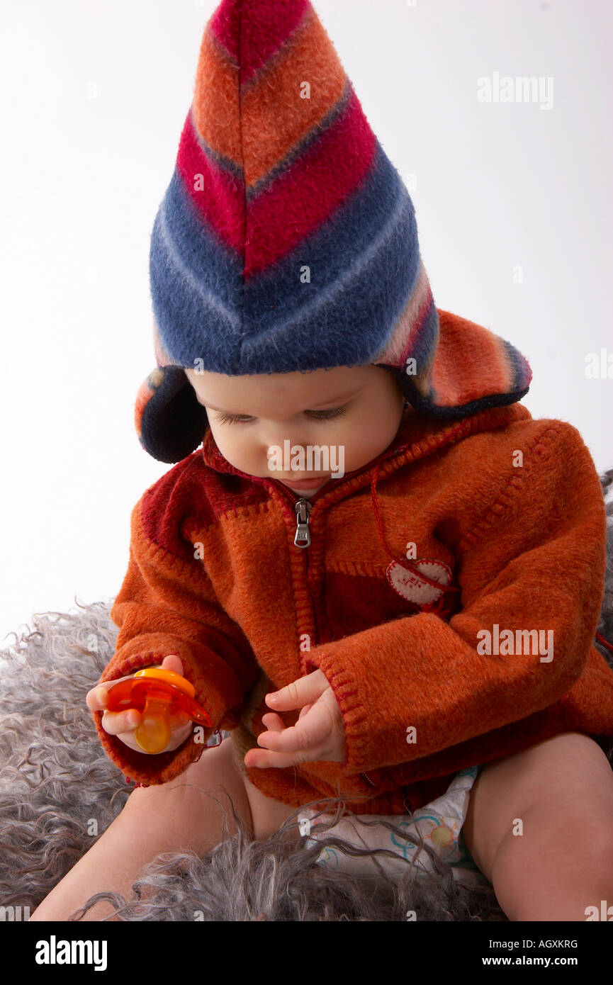 baby in colourful woollen clothes Stock Photo Alamy