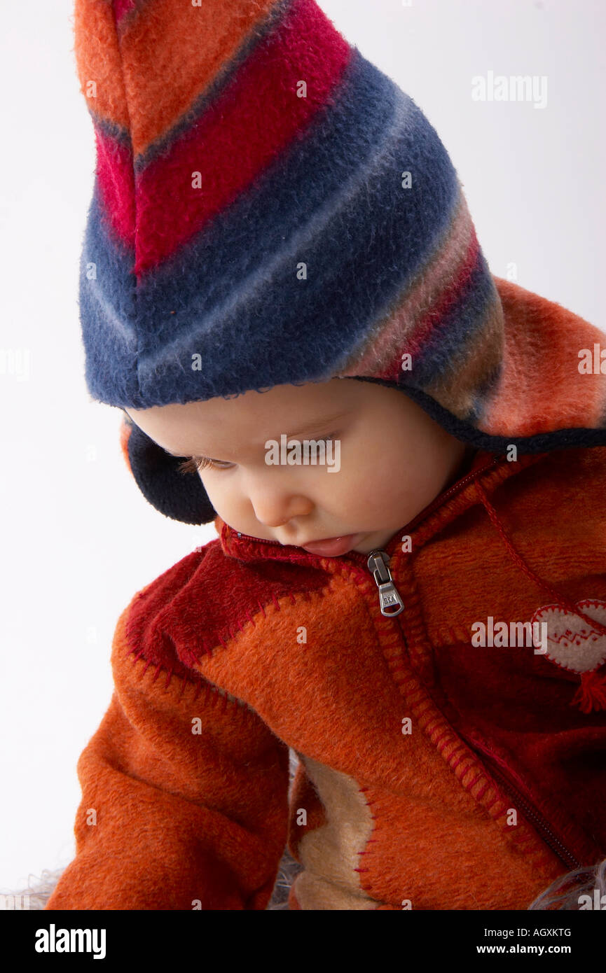 baby in colourful woollen clothes Stock Photo Alamy