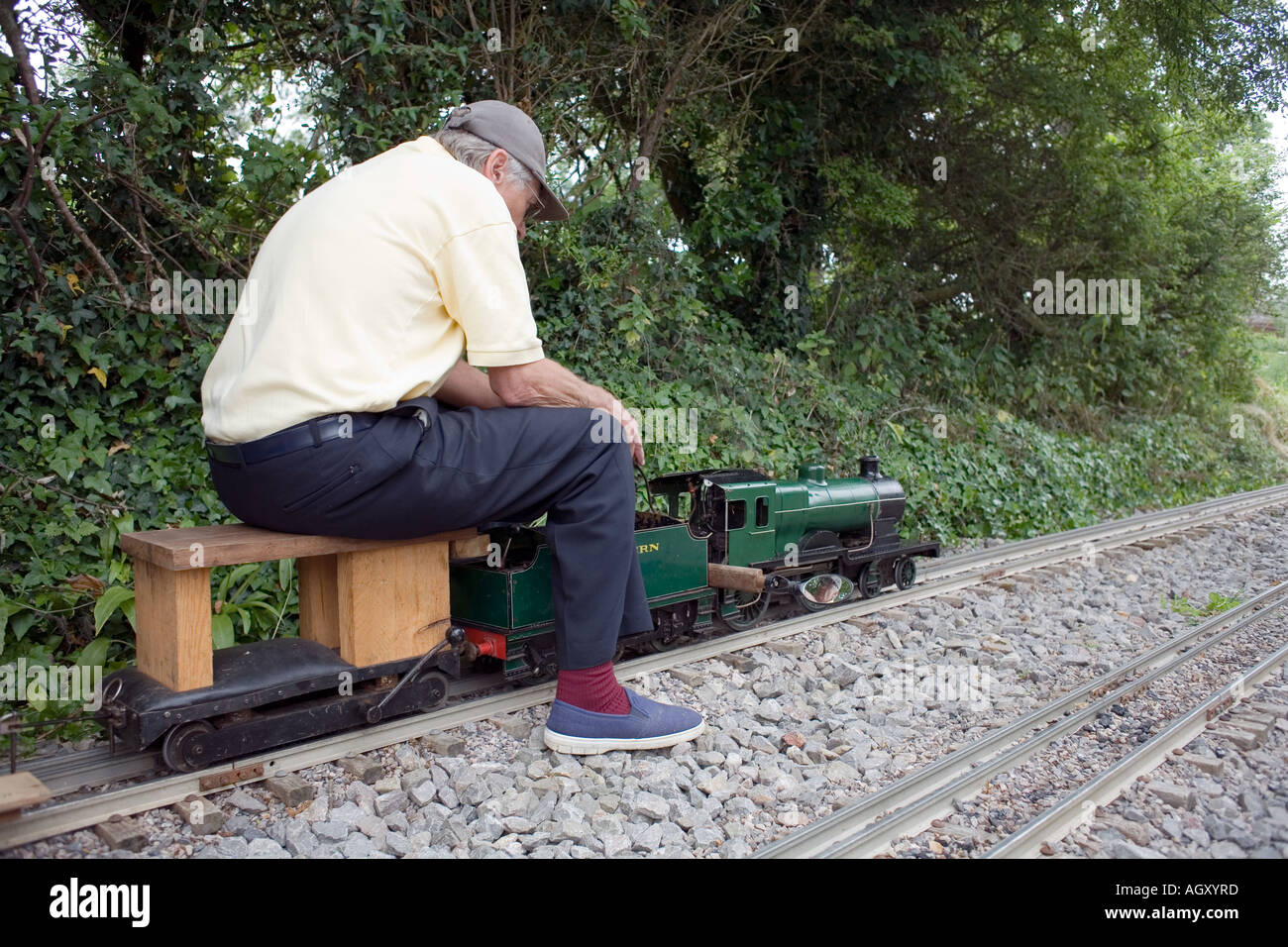 Miniature Railway Enthusiast on train, Somerset, England, UK, Stock Photo