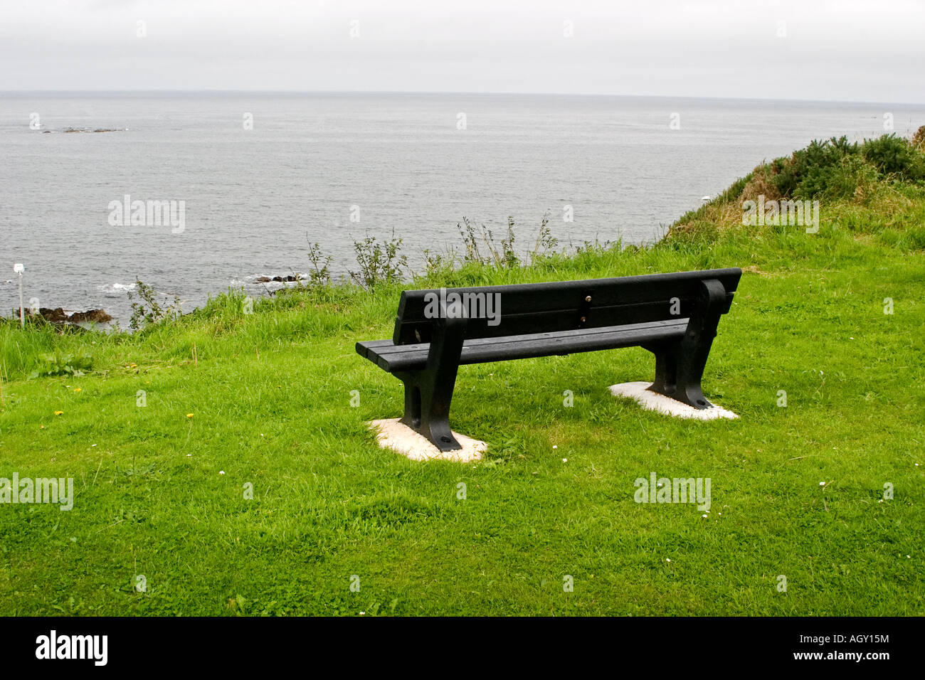 Bench overlooking the North Sea on a cloudy day in Buckie Scotland on the Moray Firth, Scotland Stock Photo
