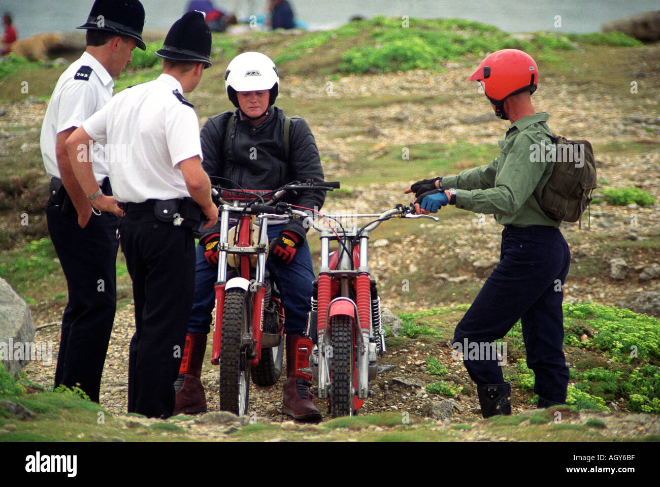 Police Officers stop two off road motorcyclists Stock Photo - Alamy