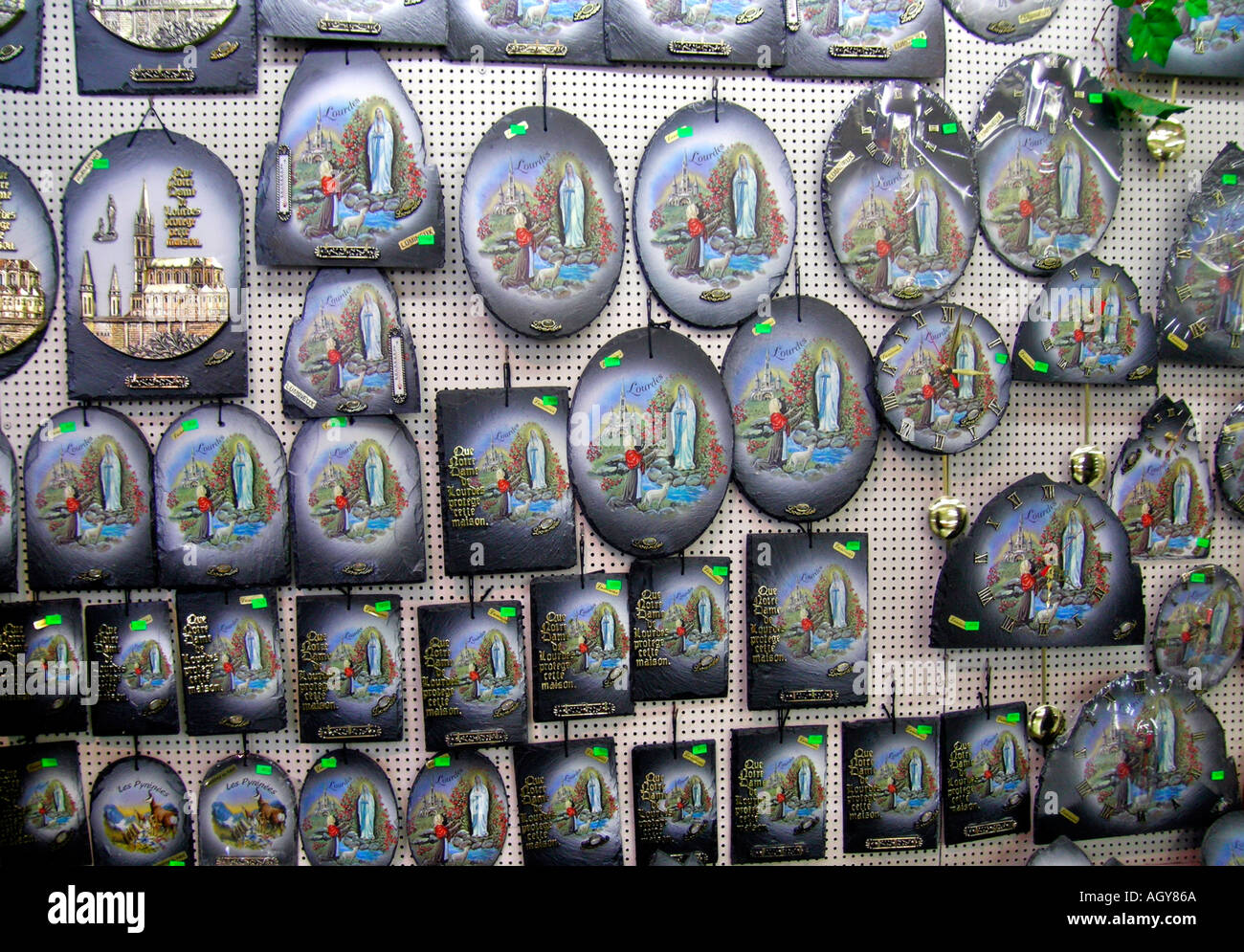 souvenirs for pilgrims in Lourdes Hautes Pyrénées France Stock Photo