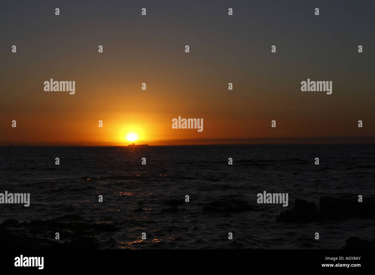 sunset at the beach Stock Photo - Alamy