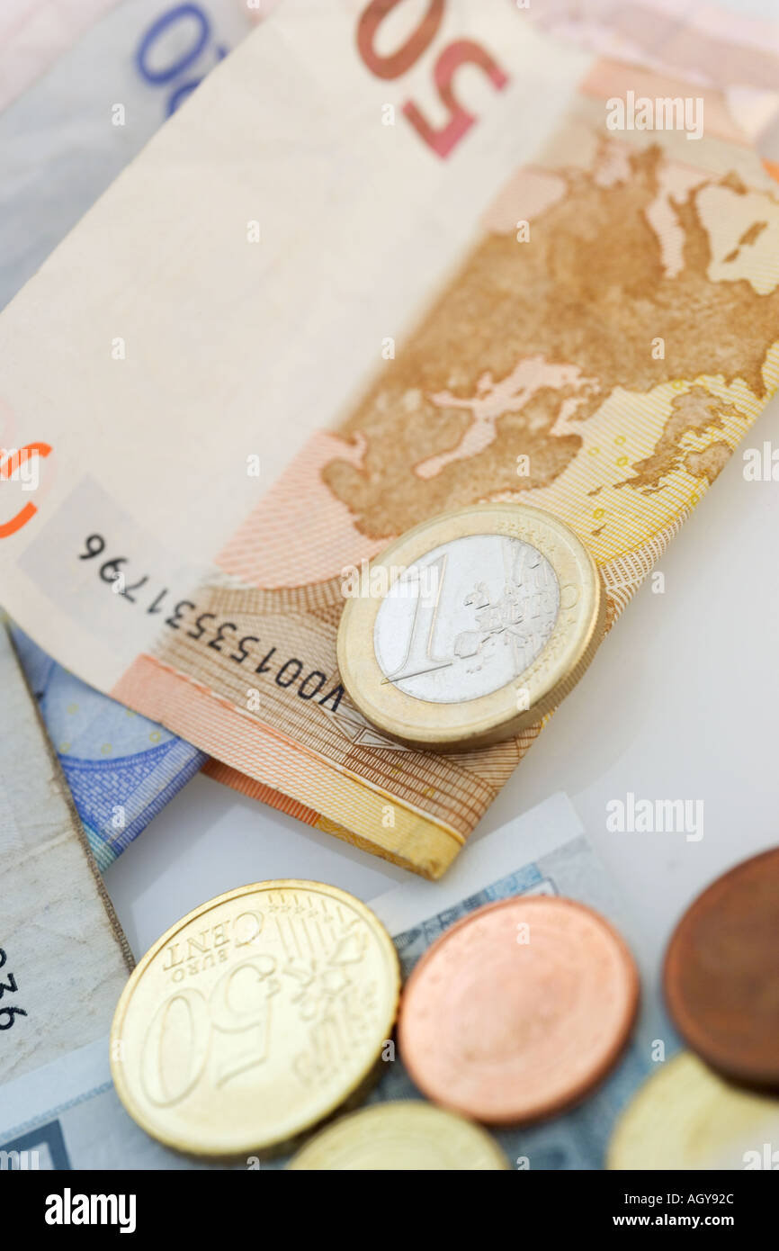 Euro bills and coins Stock Photo - Alamy