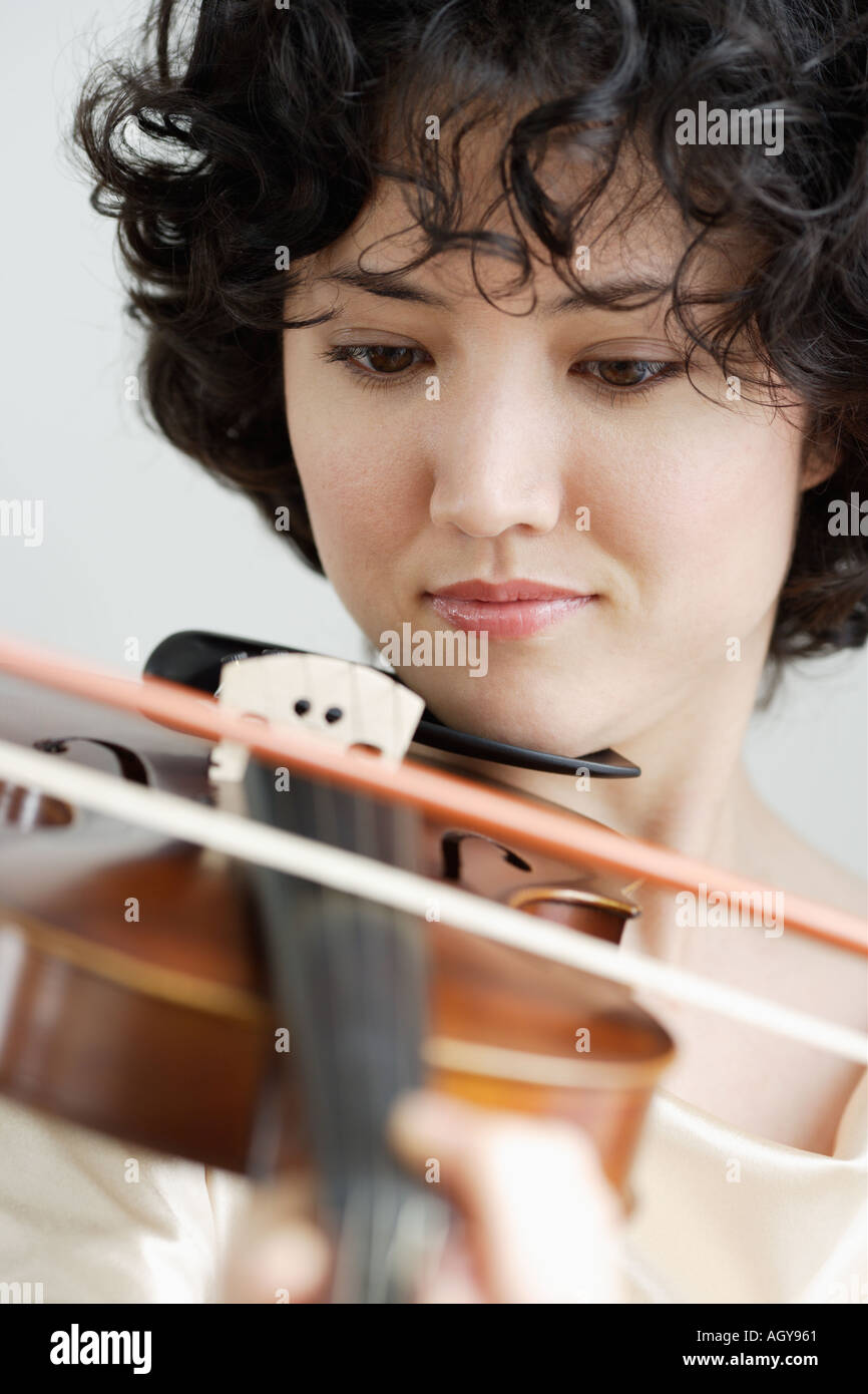 Woman playing the violin Stock Photo
