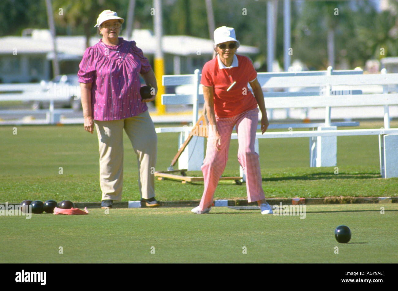 Senior females participate in lawn bowling in retirement Sun City Florida Stock Photo