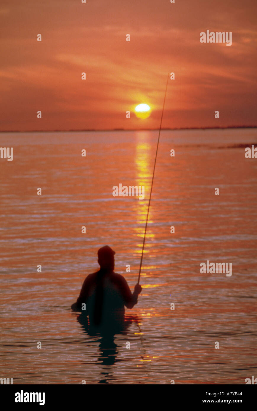 Fly fishing at sunset on Lake Okeechobee Florida Stock Photo