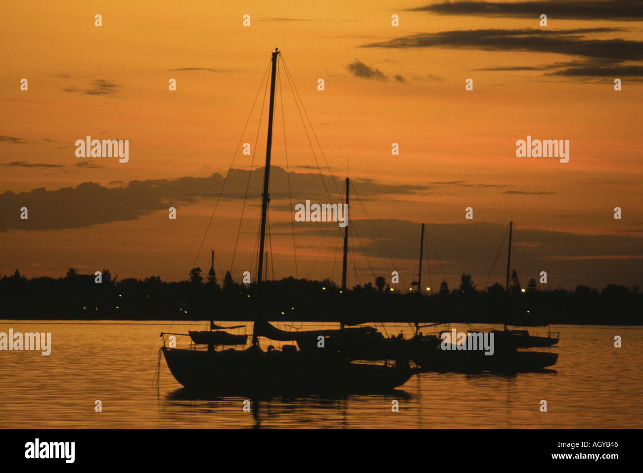 Sunset on the bay with sailboats moored Sarasota Florida Stock Photo