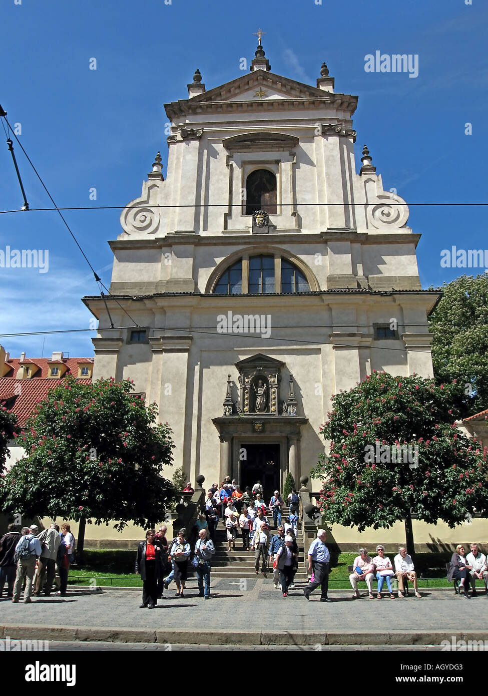Group of tourist in front of Our Lady Victorious church P M Vitezna or The Infant Jesus of Prague Church Prague CZ Stock Photo