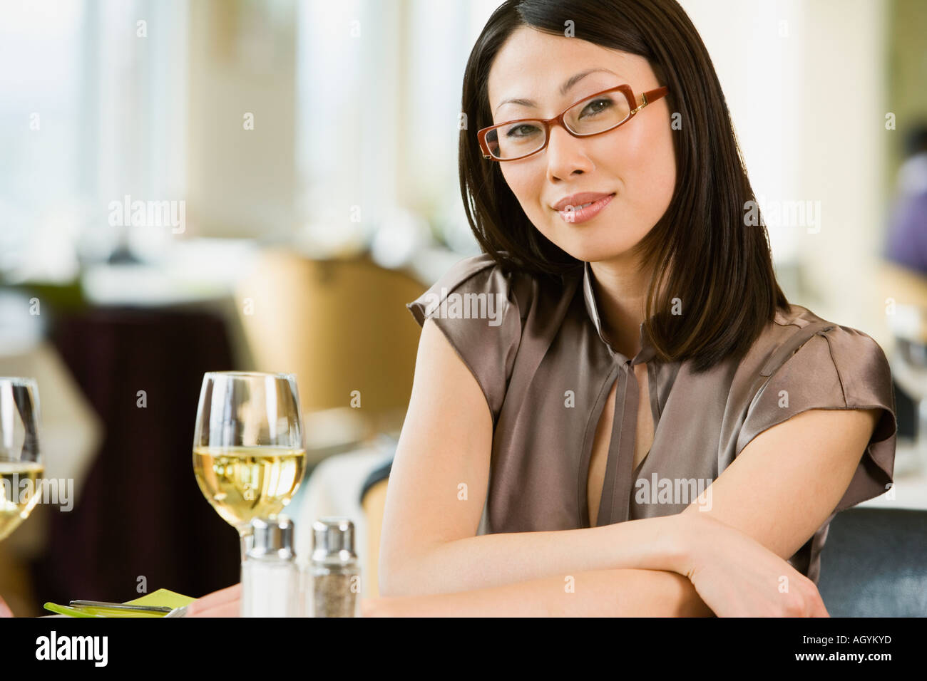 Asian businesswoman at restaurant Stock Photo