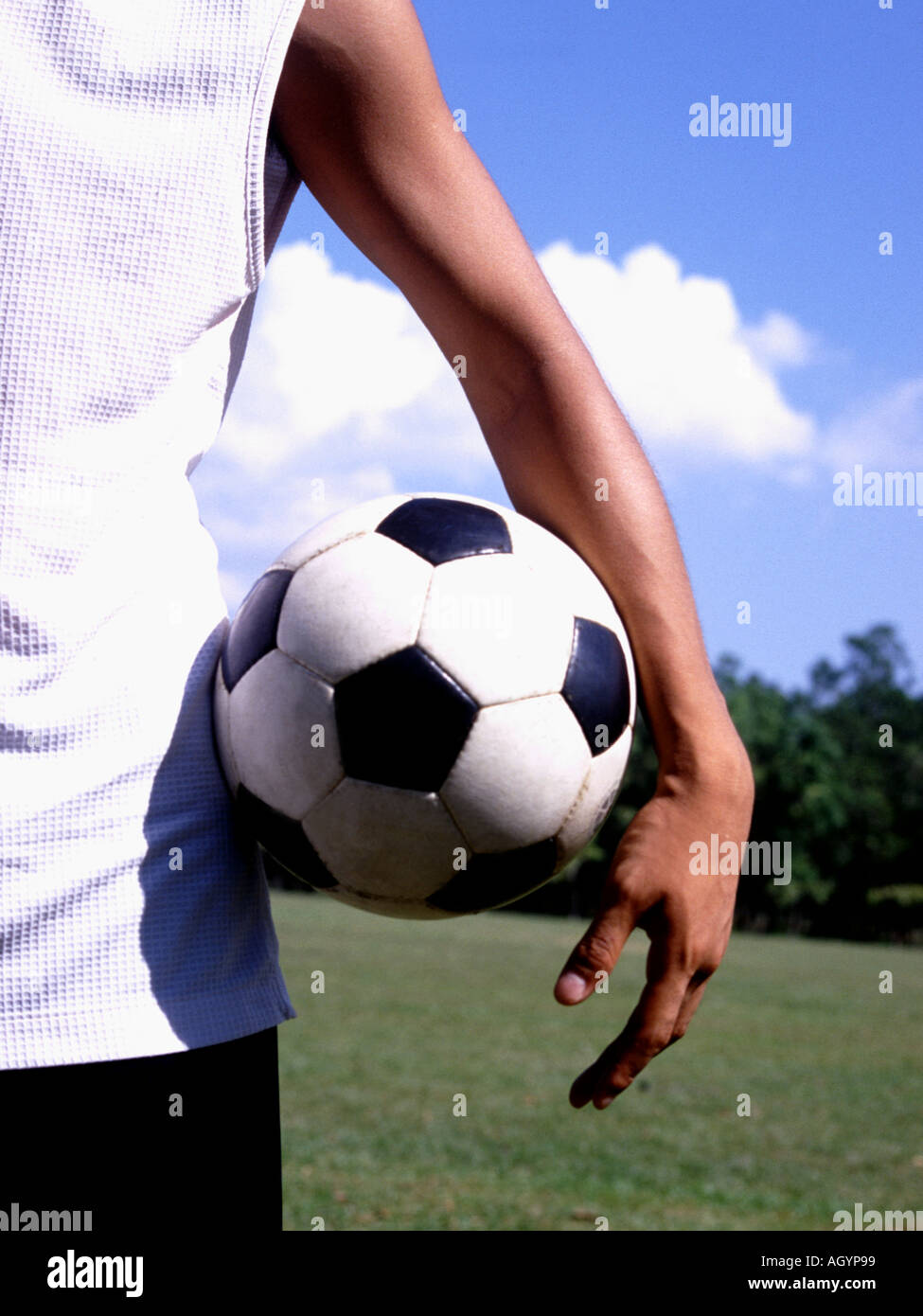 Mid section view of a man holding a soccer ball Stock Photo - Alamy