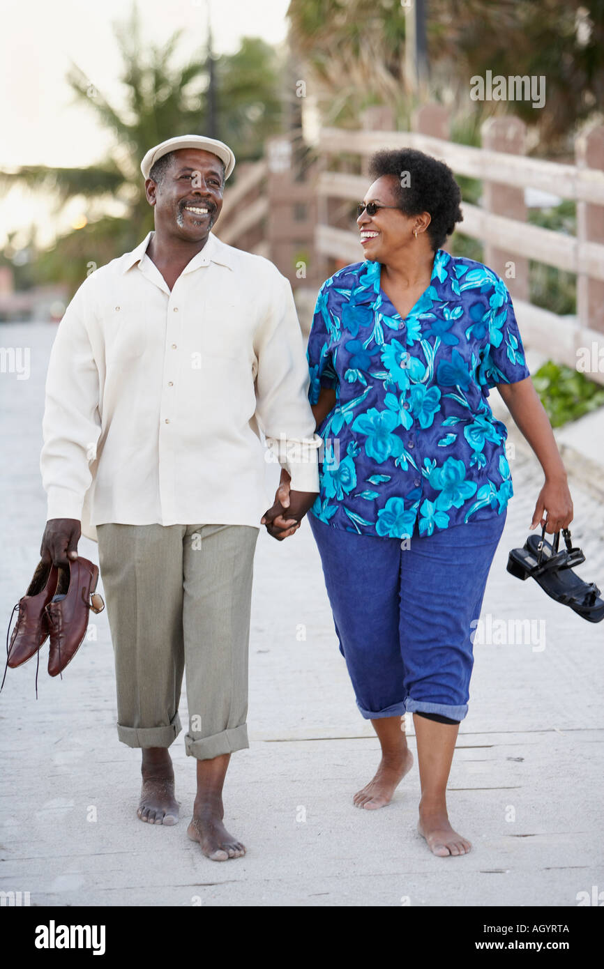 Senior African American couple walking on boardwalk Stock Photo - Alamy