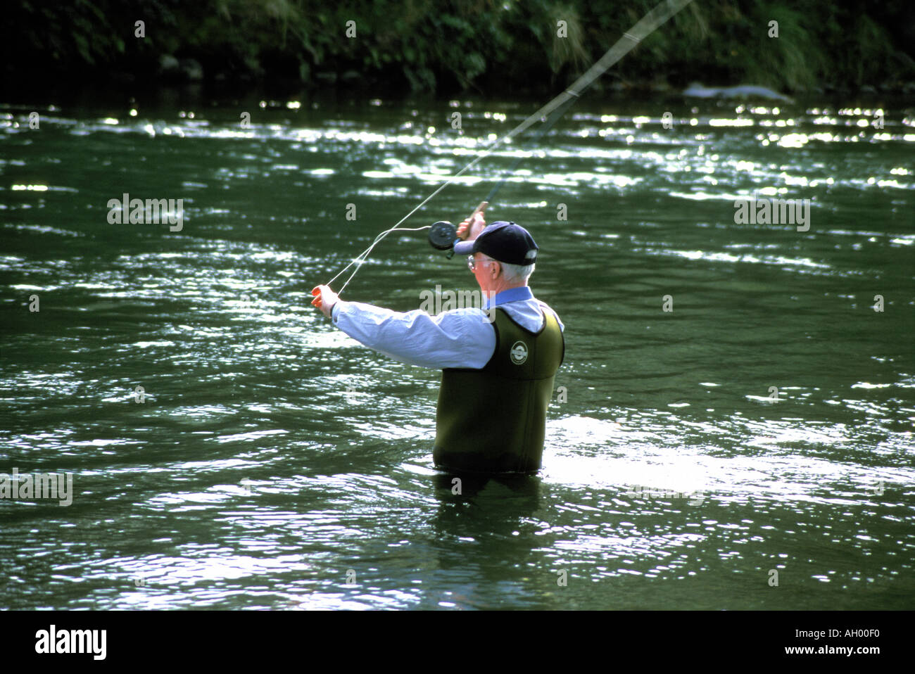 New Zealand Man fly fishing for trout at Turangi South Island Stock Photo