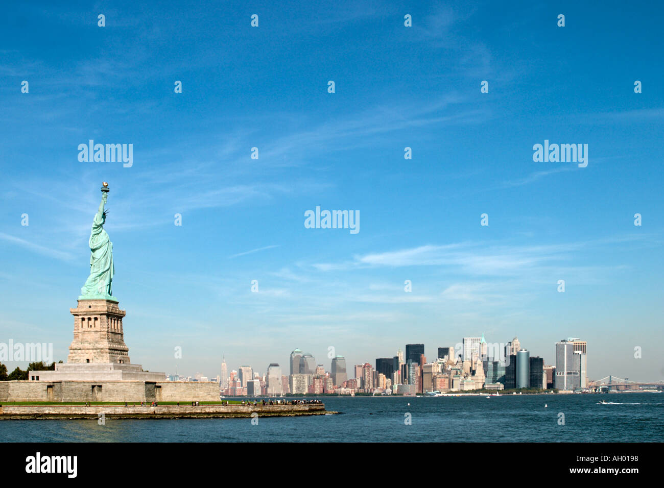 Statue of Liberty on Liberty Island with the Manhattan skyline behind ...