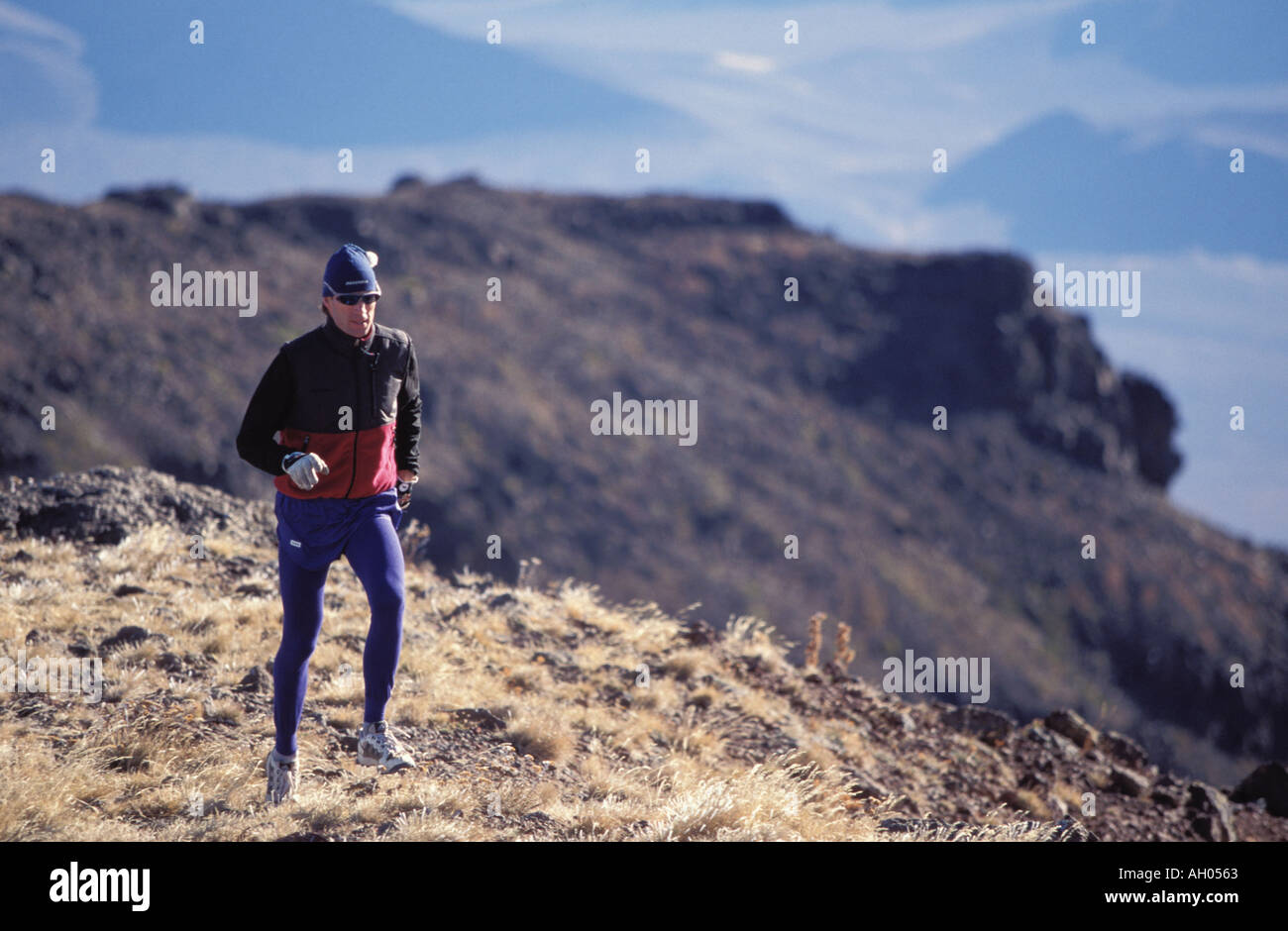 Hard Ridges Man Man Running on High Ridge Stock Photo - Alamy