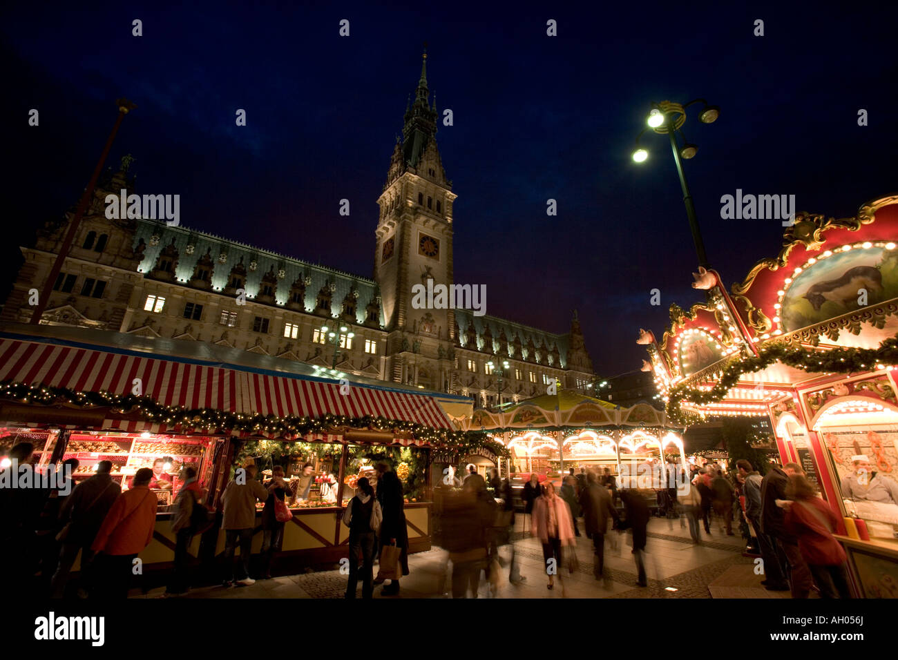 Hamburg Christmas Market lit and Town hall, Fairground,amusements,dusk