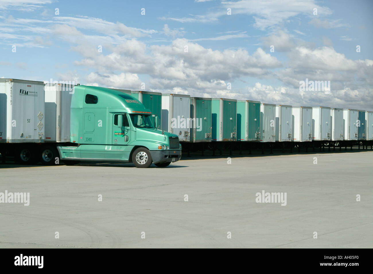 Truck With Many Trailers In Distribution Center Yard, Pennsylvania, USA Stock Photo