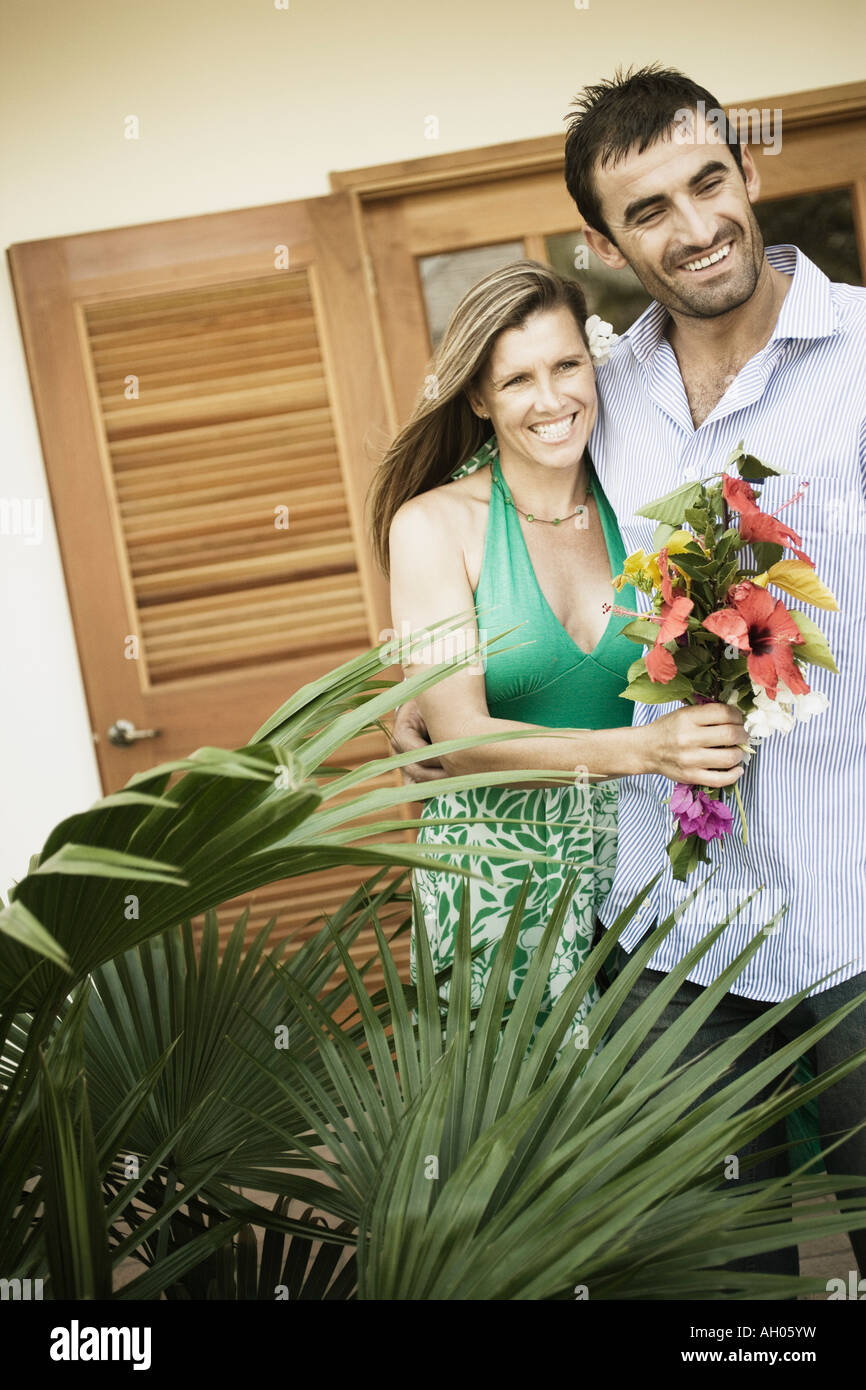 Young man and a mid adult woman standing together Stock Photo - Alamy