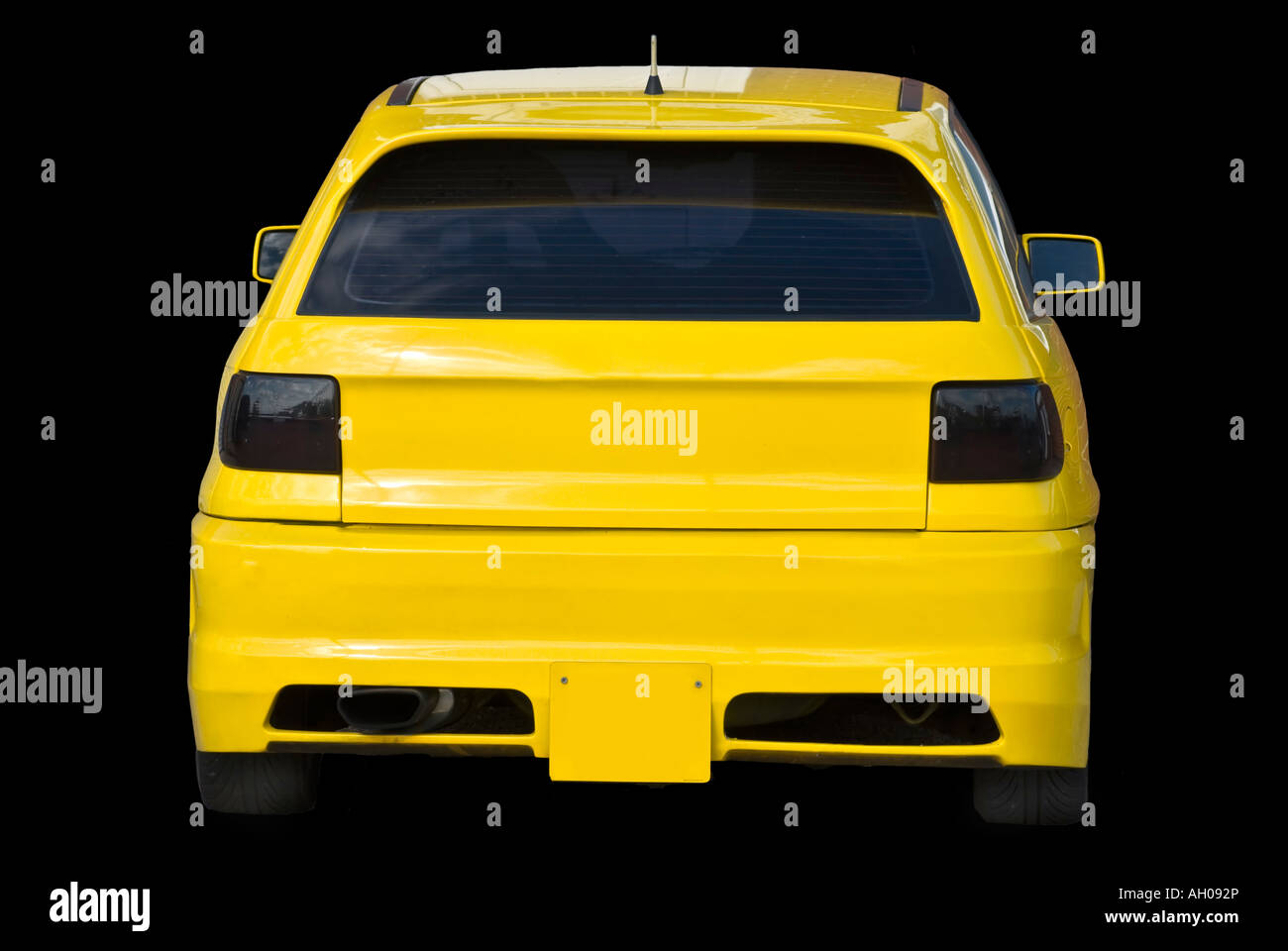 REAR VIEW CANARY YELLOW BLACK CAR Stock Photo