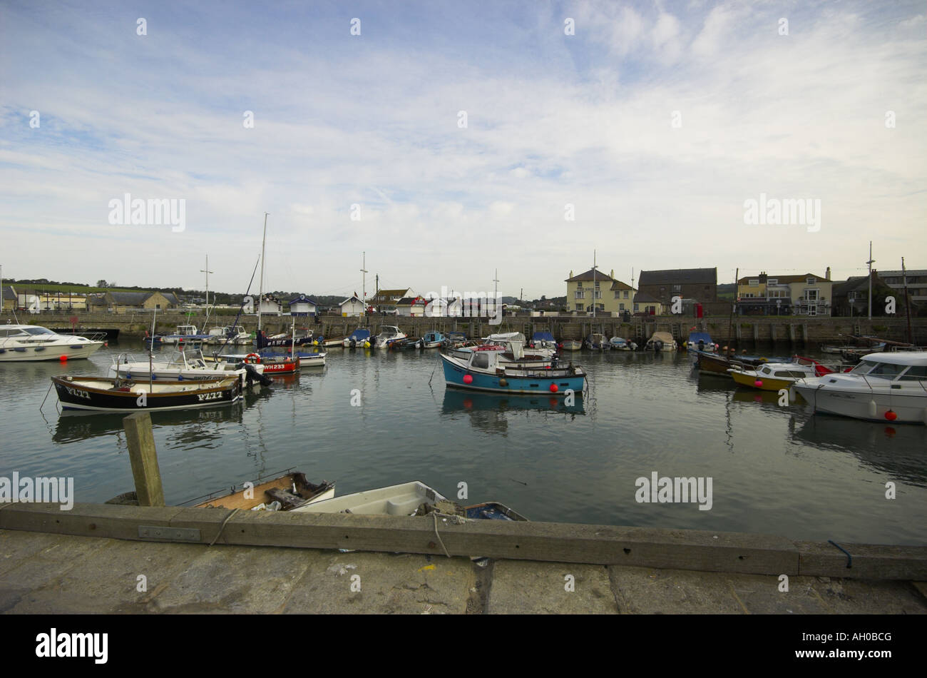 West Bay and quay dorset showing the boats in the harbour Stock Photo