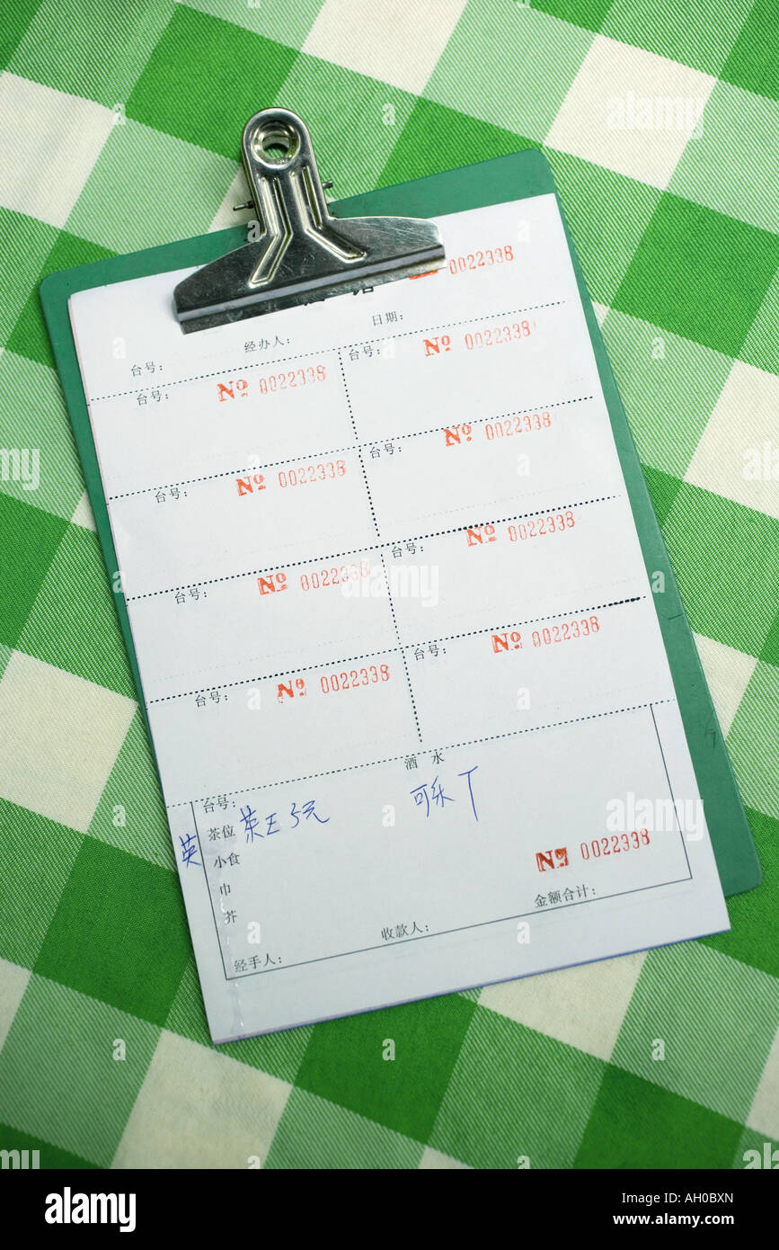 Clipboard with bills in Chinese characters Stock Photo