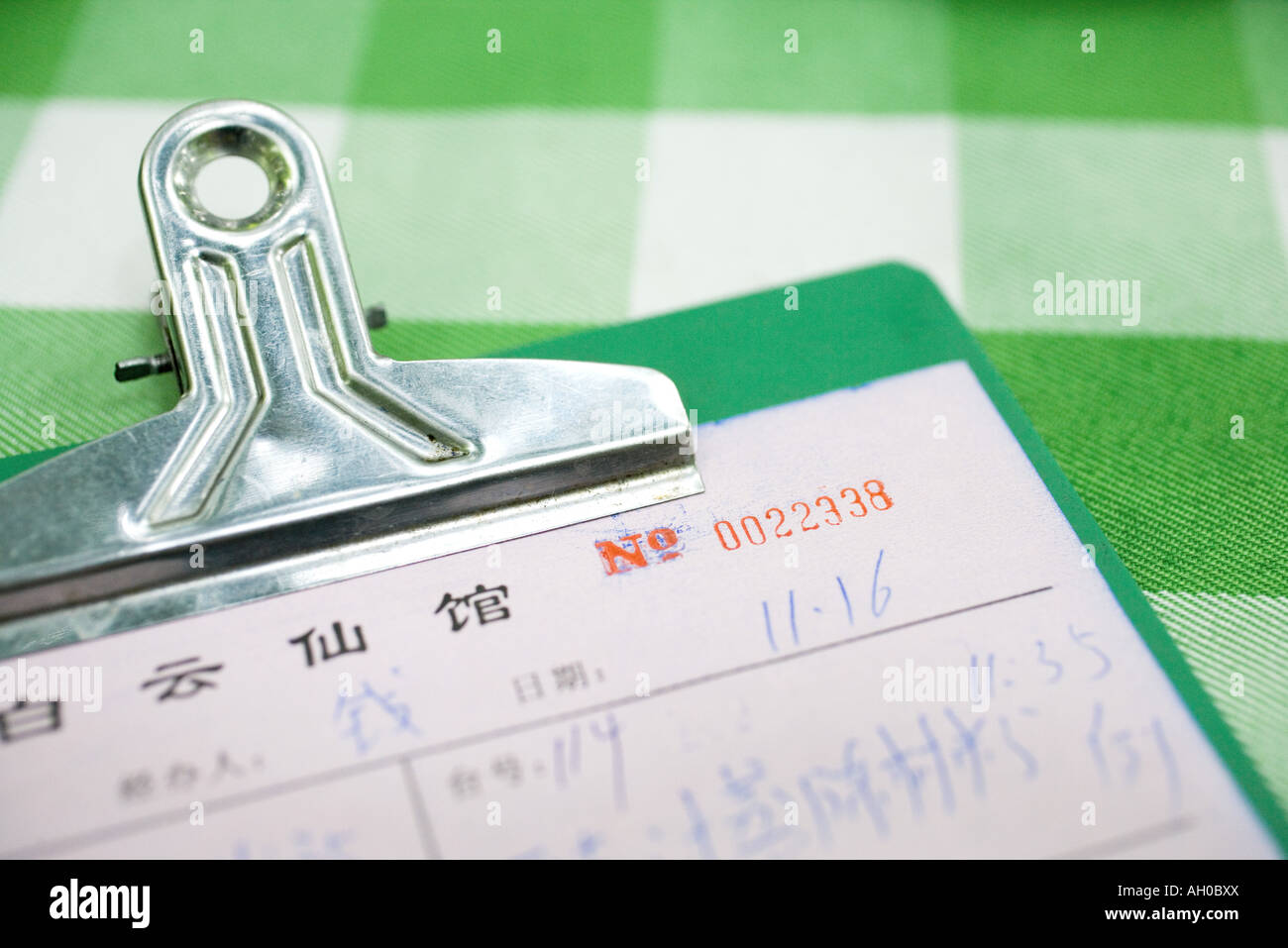 Clipboard with bills in Chinese characters Stock Photo
