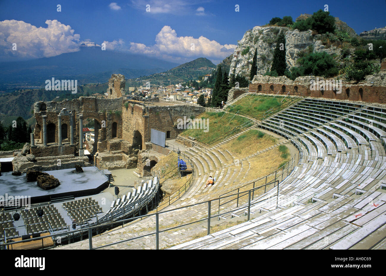 Italy Sicily Taormina Amphitheatre with a smoking Mt Etna in the background  Stock Photo