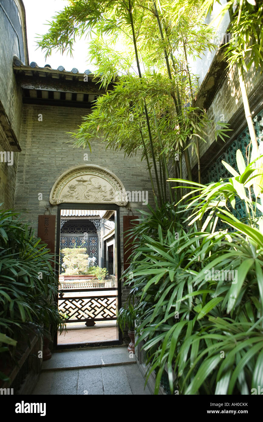 Temple courtyard with lush foliage Stock Photo