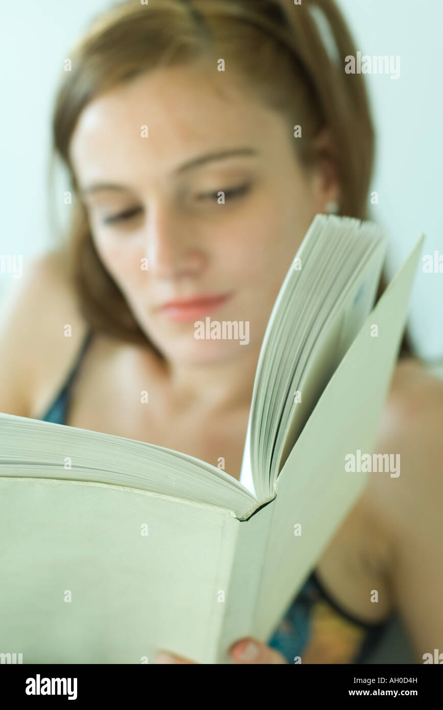 Young woman reading, focus on book Stock Photo