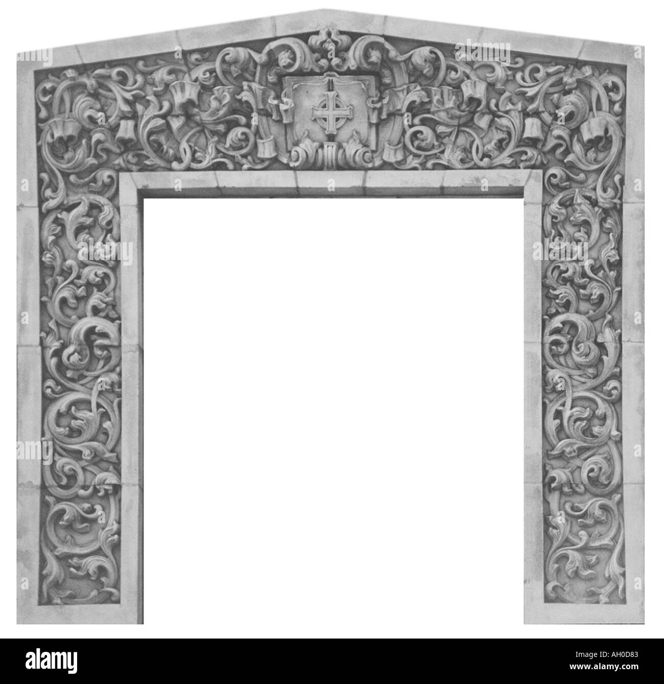 Decorative stone archway with symbolic Christian ornamentation Stock