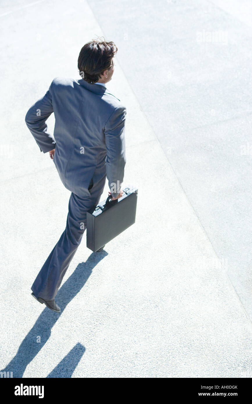 Businessman carrying briefcase, high angle view Stock Photo