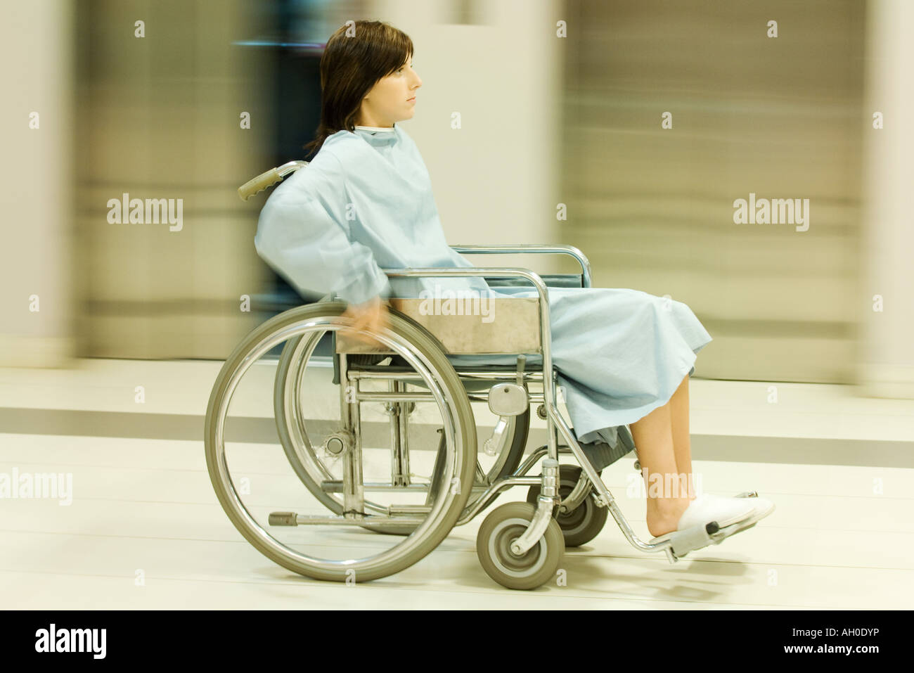 Woman using wheelchair, full length, blurred motion Stock Photo Alamy