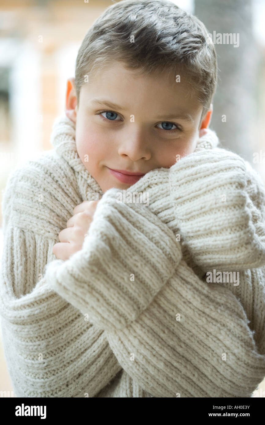 Boy wearing thick wool sweater, portrait Stock Photo